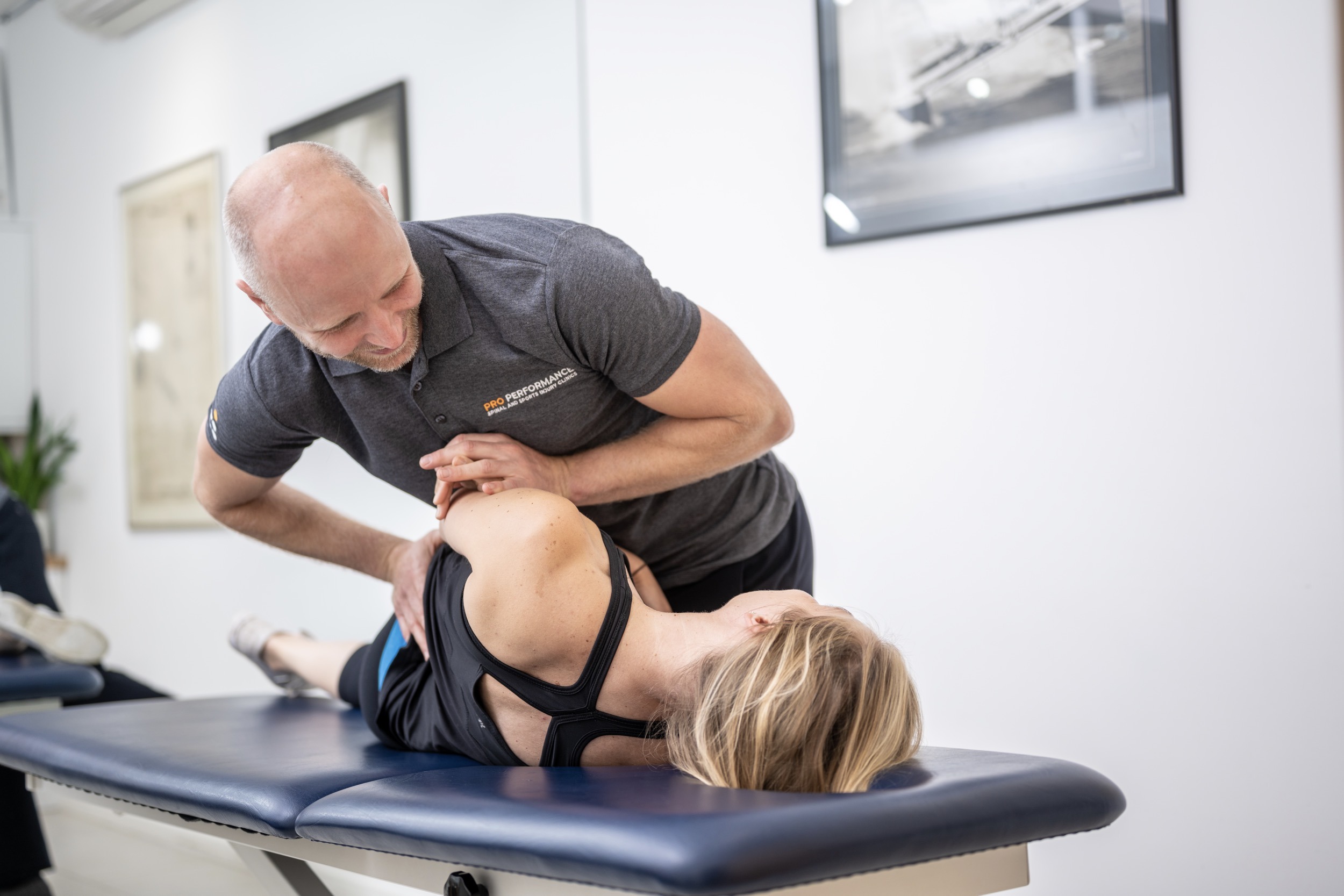 Chiropractor treating lady in the city of London